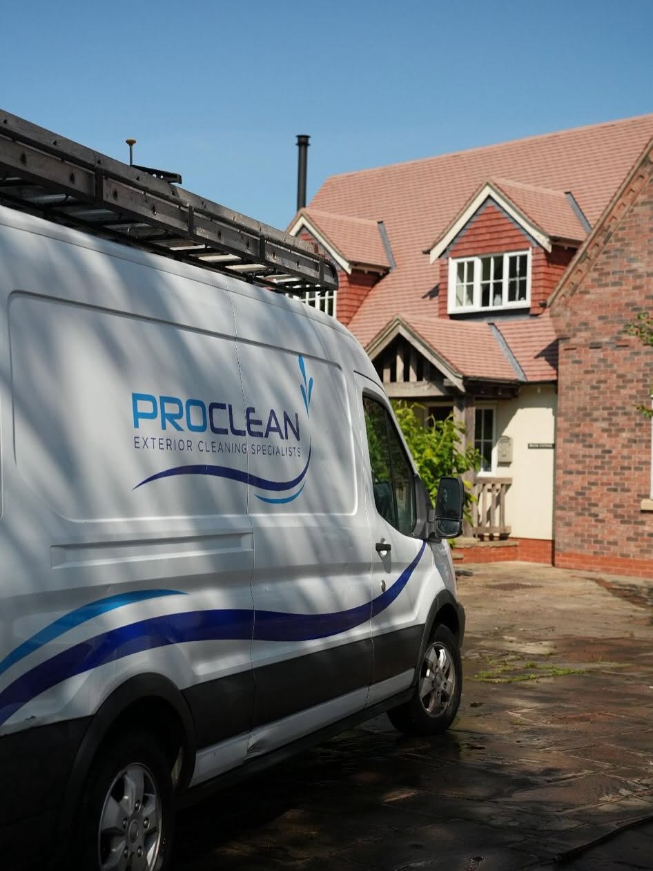 Exterior cleaning specialist working on a Manchester home