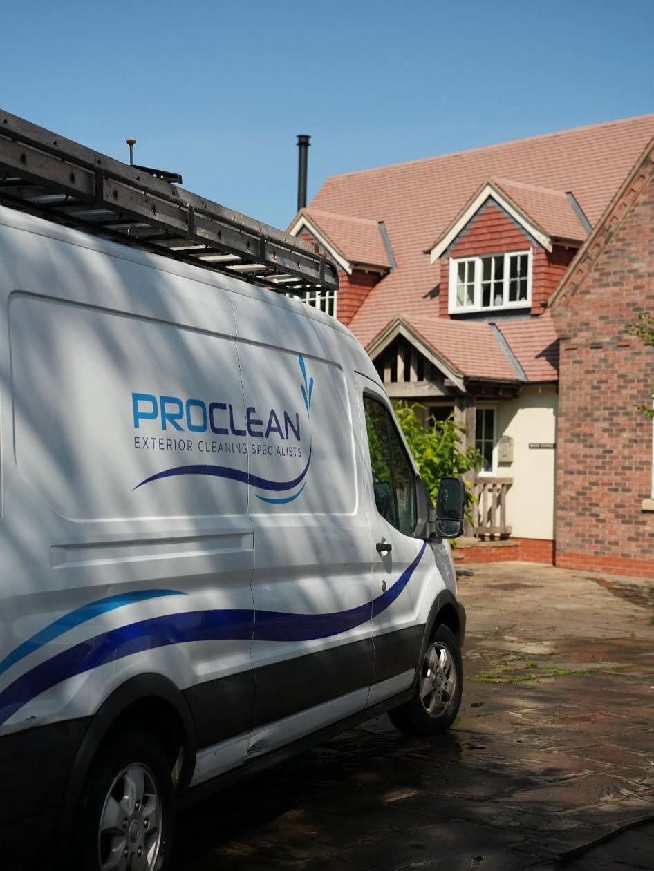 Exterior cleaning specialist working on a Manchester home
